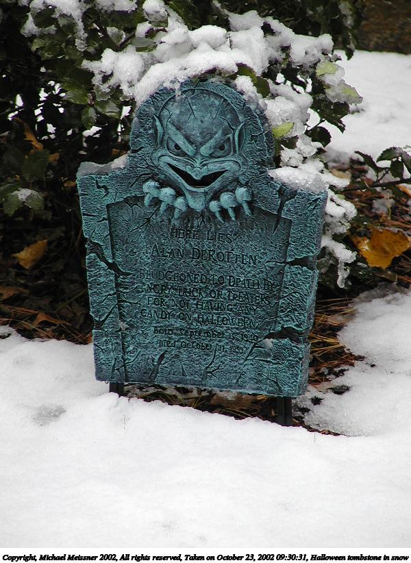 Halloween tombstone in snow