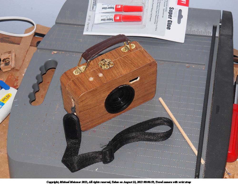 Travel camera with wrist strap