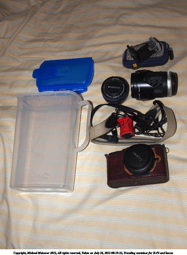 Traveling container for E-P2 and lenses
