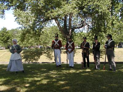 Interpreters dressed as soldier's wife, British redcoats, Iroquois warrier, Canadian warrier, Canadian militia