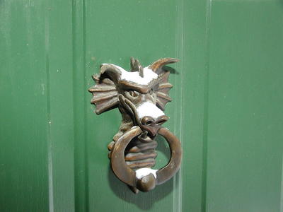 Door knocker with snow
