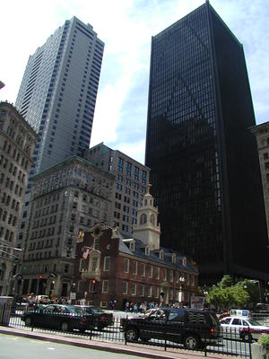 Old state house flanked by skyscrappers
