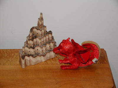 Dragon pondering castle