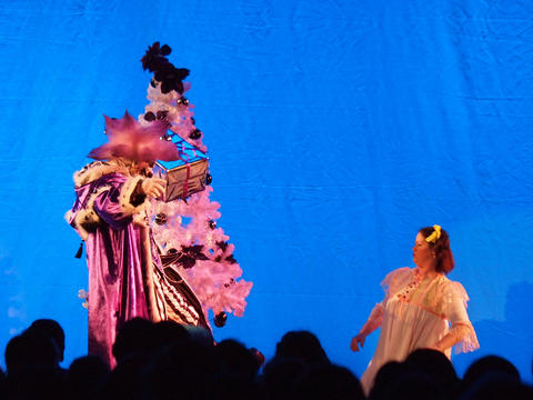 Scary clown as Santa's helper