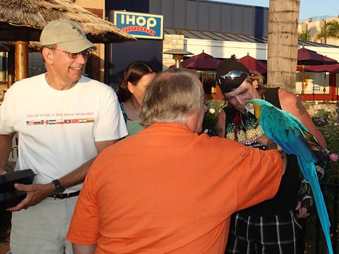 Tom and Dave with a macaw outside of Disneyland