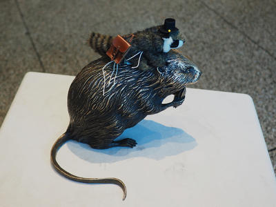 Racky rides a beaver