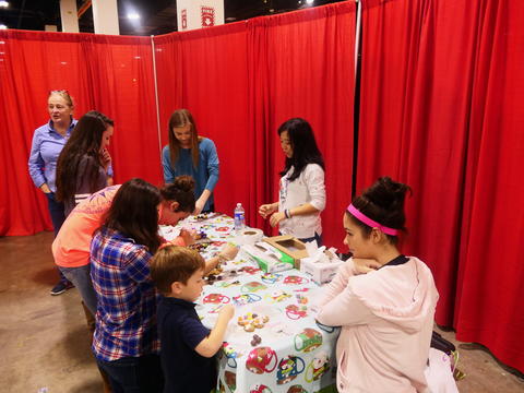 Kids decorating gingerbread