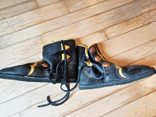 Old black and yellow 3 button boots