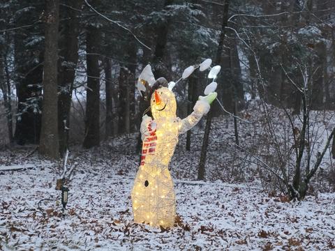 Juggling snowman sculpture